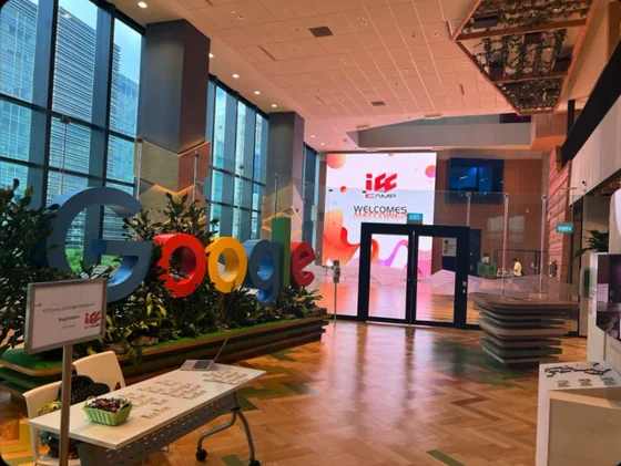 Google's office lobby in Singapore, with the Google letters and a screen reading ICC Camp welcomes.